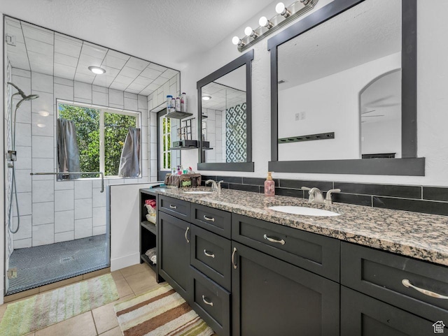 8503 S Spiral Jetty Cir W Unit 2083, West Jordan, UT 84081 - full bath with a stall shower, double vanity, tile patterned floors, and ceiling fan