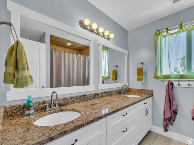 8503 S Spiral Jetty Cir W Unit 2083, West Jordan, UT 84081 - full bath with double vanity, healthy amount of natural light, and tile patterned floors
