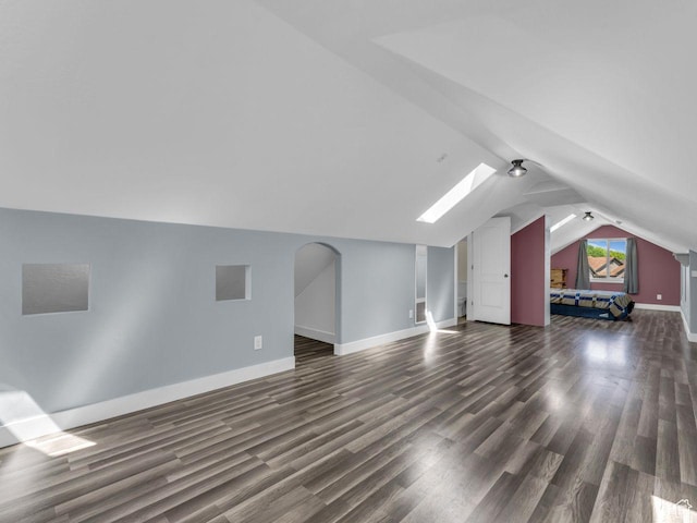 8503 S Spiral Jetty Cir W Unit 2083, West Jordan, UT 84081 - bonus room with dark wood-type flooring, vaulted ceiling, and a skylight