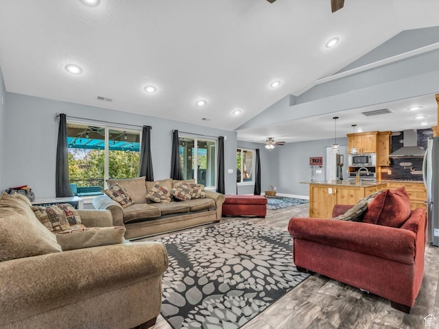 8503 S Spiral Jetty Cir W Unit 2083, West Jordan, UT 84081 - living room with a ceiling fan, lofted ceiling, wood finished floors, and recessed lighting