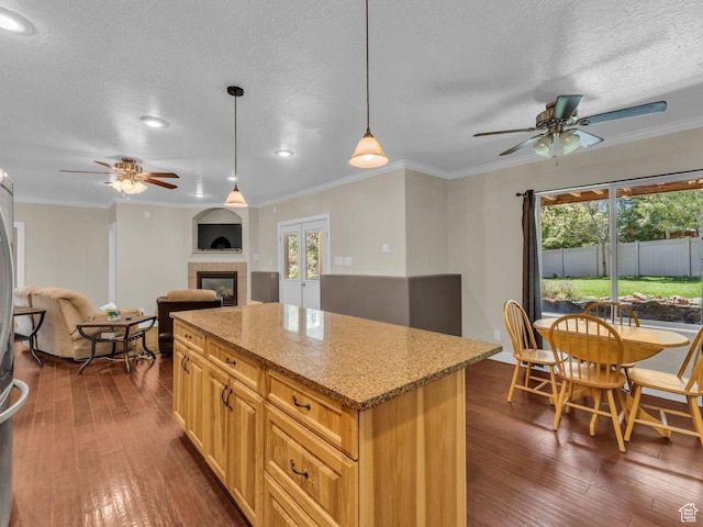 8503 S Spiral Jetty Cir W Unit 2083, West Jordan, UT 84081 - kitchen with a ceiling fan, dark wood finished floors, a tiled fireplace, open floor plan, and a textured ceiling