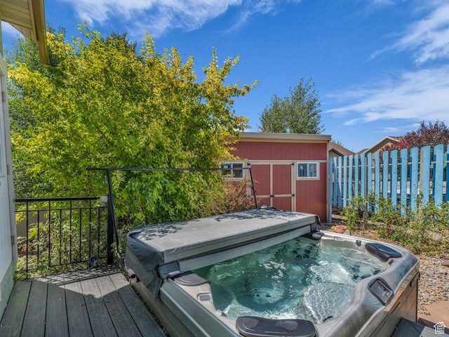 8503 S Spiral Jetty Cir W Unit 2083, West Jordan, UT 84081 - wooden terrace with a covered hot tub and a storage unit