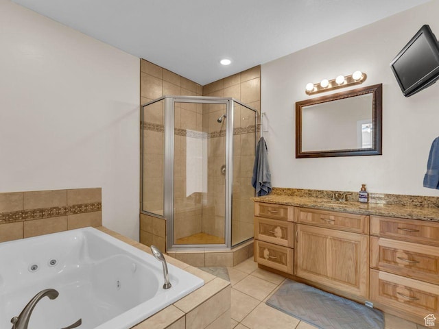 8503 S Spiral Jetty Cir W Unit 2083, West Jordan, UT 84081 - bathroom with a stall shower, a jetted tub, vanity, tile patterned floors, and recessed lighting