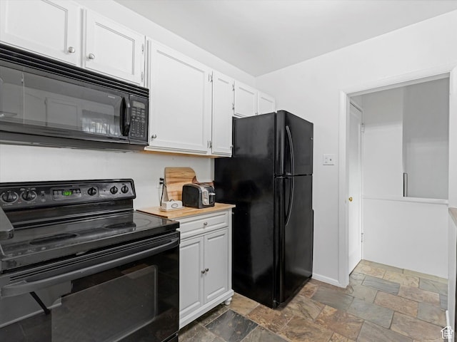 467 E 7th Ave N, Salt Lake City, UT 84103 - kitchen featuring black appliances, stone tile floors, and white cabinets