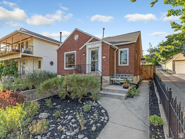 467 E 7th Ave N, Salt Lake City, UT 84103 - view of front facade featuring brick siding and a shingled roof