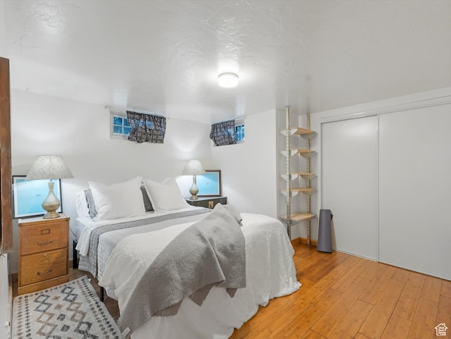 467 E 7th Ave N, Salt Lake City, UT 84103 - bedroom featuring light wood finished floors and a closet