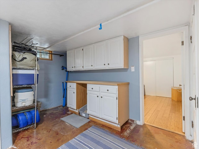 467 E 7th Ave N, Salt Lake City, UT 84103 - kitchen featuring white cabinets, concrete floors, and light countertops