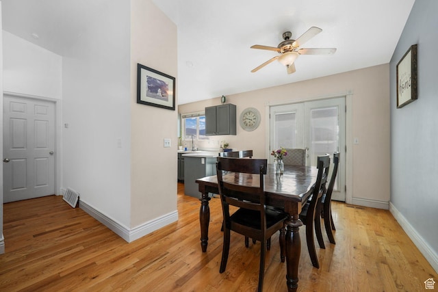 3142 S Sugar Bowl Ln, West Valley City, UT 84128 - dining area with ceiling fan, light wood-style floors, and french doors