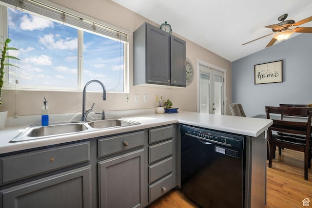 3142 S Sugar Bowl Ln, West Valley City, UT 84128 - kitchen featuring black dishwasher, gray cabinetry, a ceiling fan, vaulted ceiling, and a peninsula
