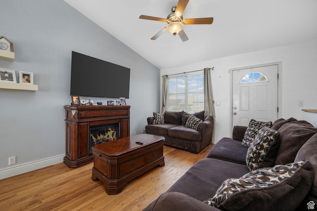 3142 S Sugar Bowl Ln, West Valley City, UT 84128 - living area featuring lofted ceiling, ceiling fan, light wood-style floors, and a fireplace