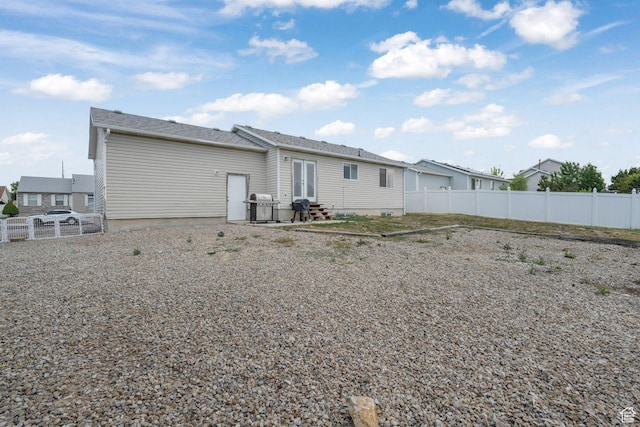 3142 S Sugar Bowl Ln, West Valley City, UT 84128 - back of property featuring entry steps, a fenced backyard, and french doors