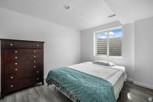 3142 S Sugar Bowl Ln, West Valley City, UT 84128 - bedroom featuring wood finished floors and baseboards