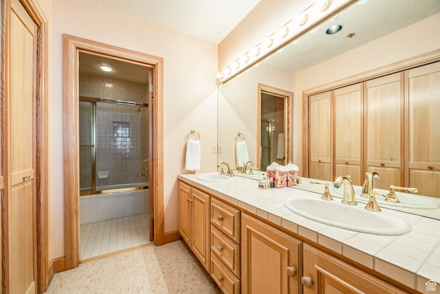 8200 Royal St Unit 43, Park City, UT 84060 - bathroom with double vanity, speckle patterned floor, and shower / bath combination with glass door