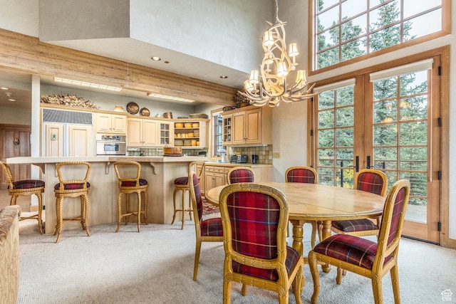 8200 Royal St Unit 43, Park City, UT 84060 - dining area featuring a chandelier, light colored carpet, recessed lighting, a high ceiling, and french doors
