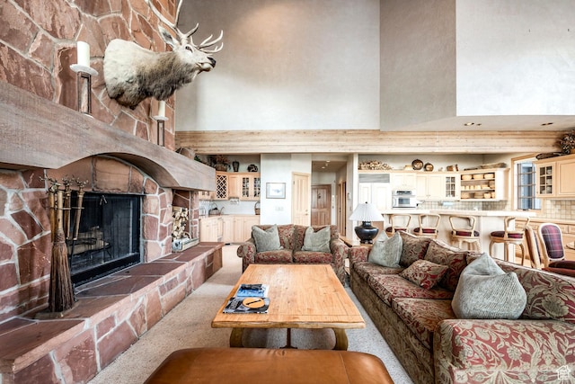 8200 Royal St Unit 43, Park City, UT 84060 - living room with a high ceiling, carpet flooring, and a stone fireplace
