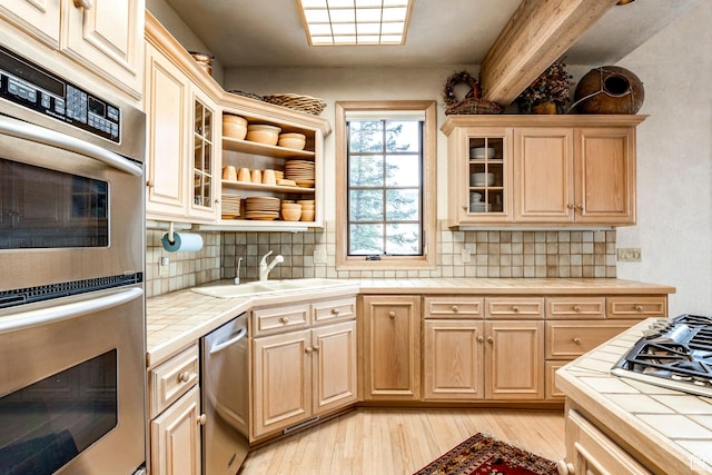 8200 Royal St Unit 43, Park City, UT 84060 - kitchen with tile countertops, appliances with stainless steel finishes, light wood finished floors, decorative backsplash, and beam ceiling