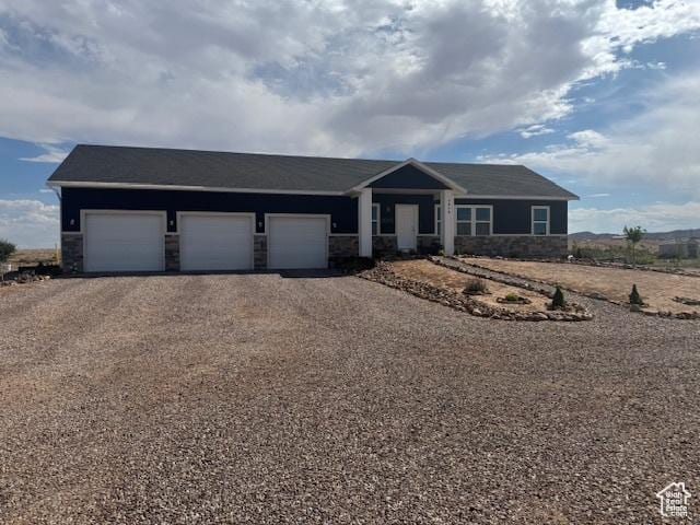 4058 E 5000 S, Vernal, UT 84078 - ranch-style home featuring driveway, stone siding, and a garage