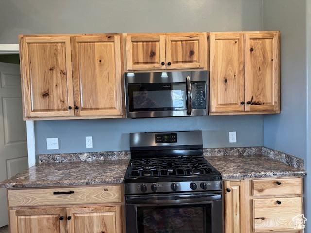 4058 E 5000 S, Vernal, UT 84078 - kitchen featuring stainless steel appliances, light brown cabinetry, and dark stone counters