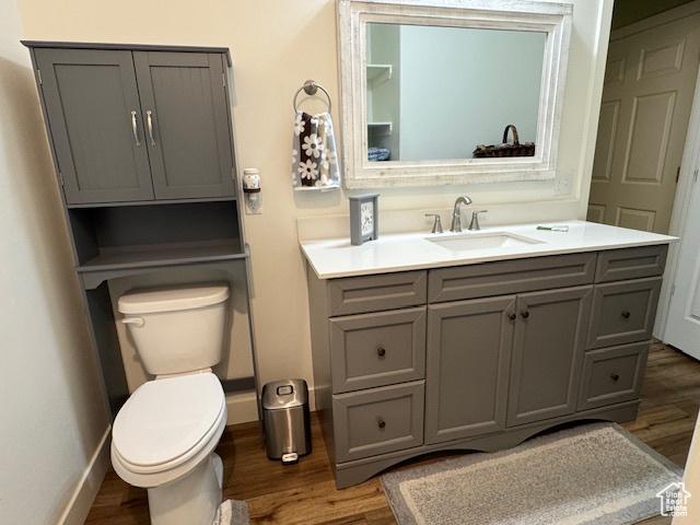 4058 E 5000 S, Vernal, UT 84078 - bathroom with wood finished floors and vanity