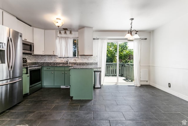 4287 W Stratus S, Kearns, UT 84118 - kitchen with appliances with stainless steel finishes, green cabinetry, decorative backsplash, and white cabinetry