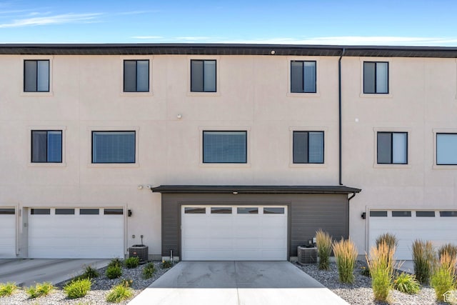 514 S 900 W Unit 167, American Fork, UT 84003 - view of property featuring stucco siding, an attached garage, and concrete driveway
