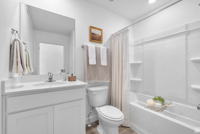 352 E 1275 N Unit 130, Harrisville, UT 84404 - bathroom with wood finished floors, vanity, and shower / tub combo with curtain