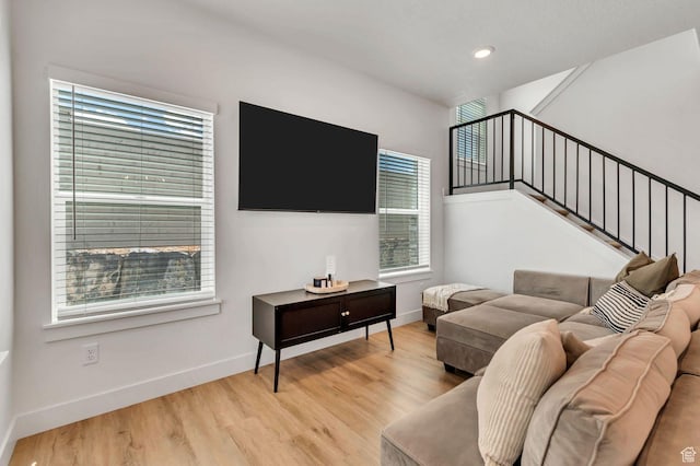 1162 N 550 W Unit 110, Tooele, UT 84074 - living room with light wood finished floors, stairway, and recessed lighting