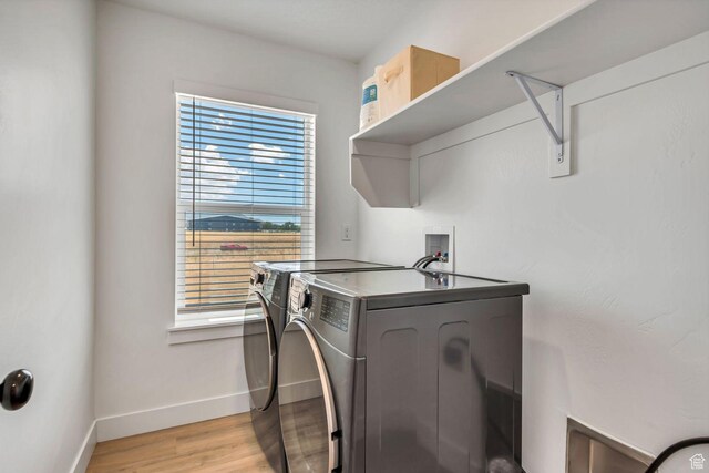 1162 N 550 W Unit 110, Tooele, UT 84074 - laundry room featuring separate washer and dryer and light wood-style flooring