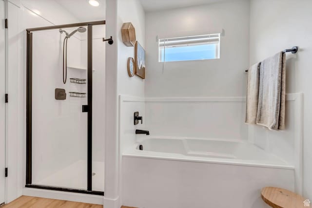 1162 N 550 W Unit 110, Tooele, UT 84074 - full bathroom featuring a garden tub, a shower stall, and wood finished floors