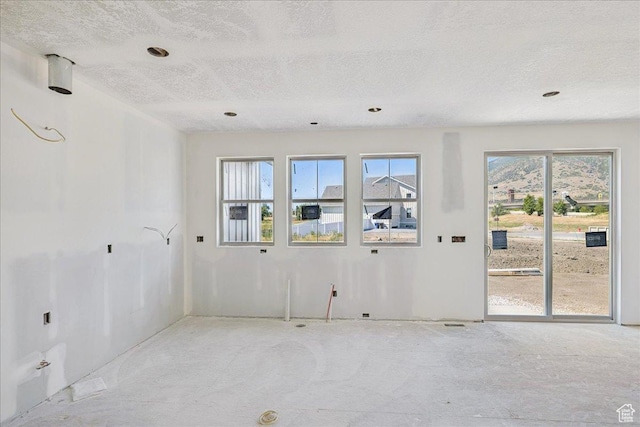 592 W Kennard Ln Unit 212, Farmington, UT 84025 - spare room with a textured ceiling and recessed lighting