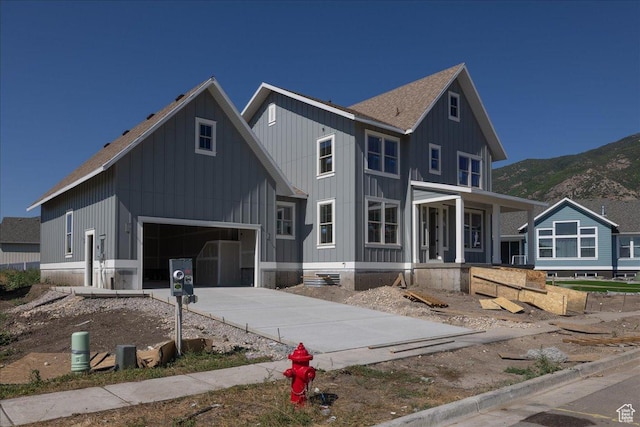 592 W Kennard Ln Unit 212, Farmington, UT 84025 - modern farmhouse with a porch, a mountain view, a garage, board and batten siding, and driveway