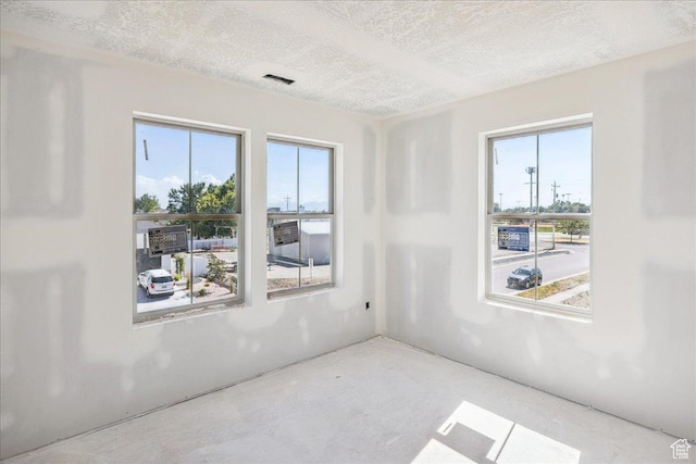 592 W Kennard Ln Unit 212, Farmington, UT 84025 - unfurnished room with a textured ceiling