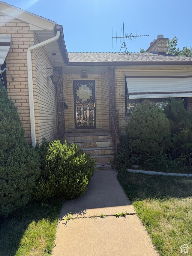 5166 S 2150 W, Roy, UT 84067 - entrance to property featuring brick siding and a chimney