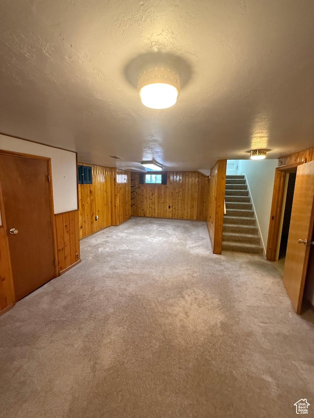 5166 S 2150 W, Roy, UT 84067 - below grade area featuring wood walls, stairway, and light carpet