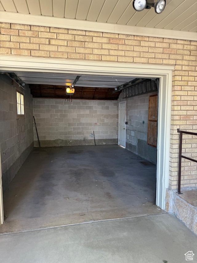 5166 S 2150 W, Roy, UT 84067 - garage featuring a garage door opener