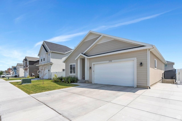 7194 N Clear Meadow Way, Eagle Mountain, UT 84005 - view of front facade featuring concrete driveway, a garage, and a residential view