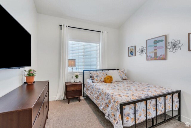7194 N Clear Meadow Way, Eagle Mountain, UT 84005 - bedroom featuring light carpet and lofted ceiling