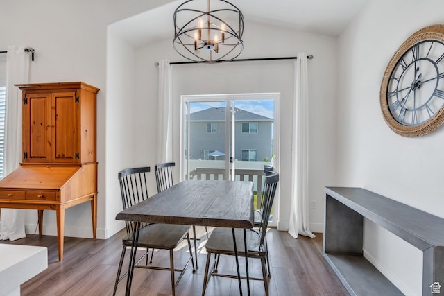 7194 N Clear Meadow Way, Eagle Mountain, UT 84005 - dining area featuring a chandelier, wood finished floors, and lofted ceiling