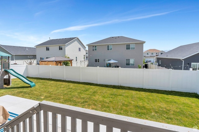7194 N Clear Meadow Way, Eagle Mountain, UT 84005 - fenced backyard with a residential view, a gazebo, and a playground
