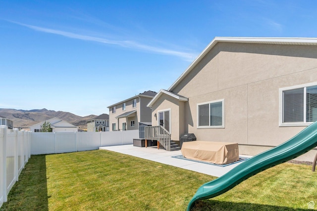 7194 N Clear Meadow Way, Eagle Mountain, UT 84005 - fenced backyard with a patio