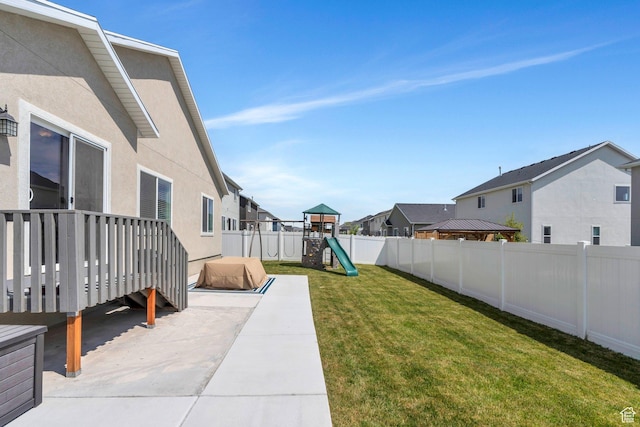 7194 N Clear Meadow Way, Eagle Mountain, UT 84005 - fenced backyard featuring a playground and a residential view