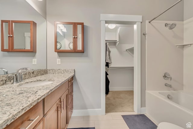 7162 S Beamon St W, West Jordan, UT 84084 - full bathroom featuring bathing tub / shower combination, vanity, tile patterned floors, and a walk in closet
