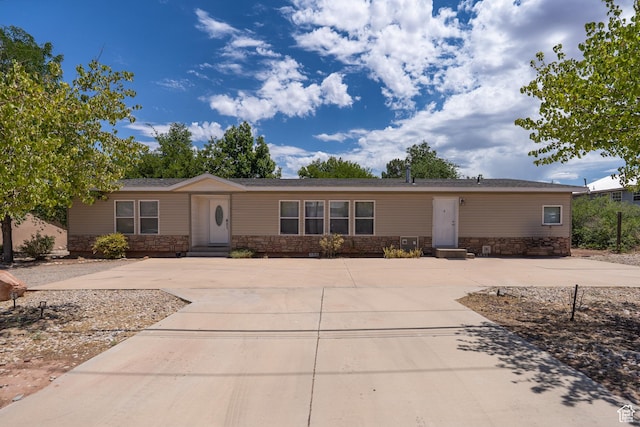 975 S 400 E, Moab, UT 84532 - view of front of property with stone siding and concrete driveway