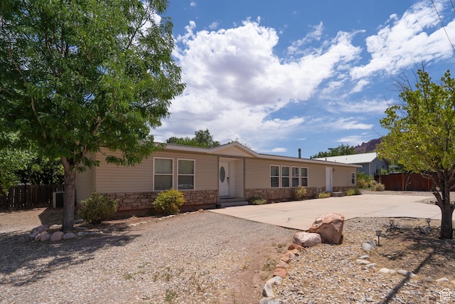 975 S 400 E, Moab, UT 84532 - view of front facade featuring concrete driveway and stone siding
