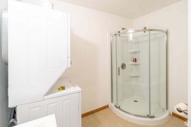 975 S 400 E, Moab, UT 84532 - bathroom with stacked washer and clothes dryer and a stall shower