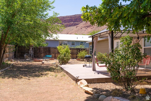 975 S 400 E, Moab, UT 84532 - fenced backyard featuring a gazebo, a mountain view, a patio area, and a fire pit