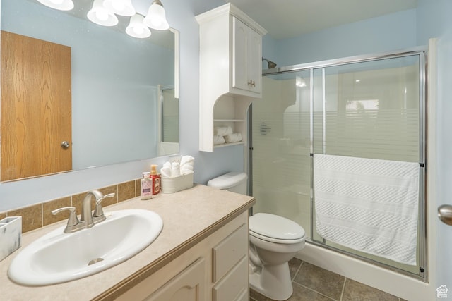 975 S 400 E, Moab, UT 84532 - bathroom featuring a stall shower, tile patterned flooring, and vanity