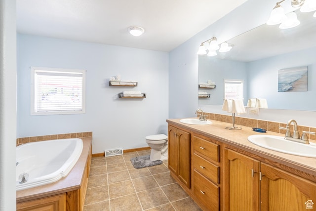 975 S 400 E, Moab, UT 84532 - bathroom featuring plenty of natural light, double vanity, tile patterned floors, and a garden tub