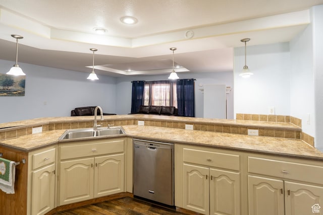 975 S 400 E, Moab, UT 84532 - kitchen with dishwasher, a tray ceiling, cream cabinetry, light countertops, and dark wood-style floors