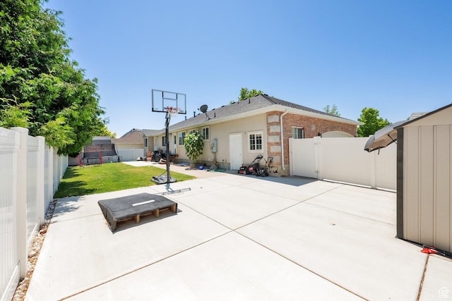 1569 Troon Cir, Syracuse, UT 84075 - fenced backyard with a gate and a patio